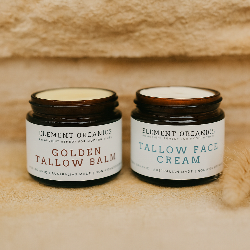 Two jars of Element Organics tallow skincare on a textured beige sandstone background